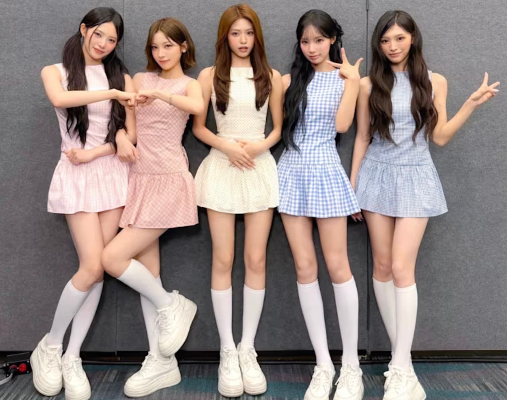 The five members of Rescene pose together in pastel dresses for a group photo shared on the group's official Instagram.